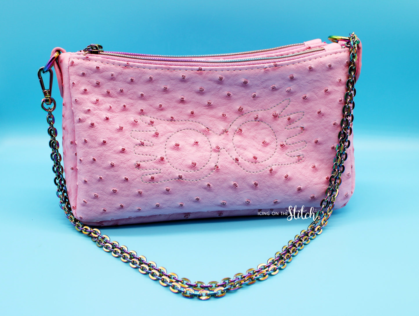 Quibbler-Themed Pink Ostrich Faux Leather Aries Crossbody Bag