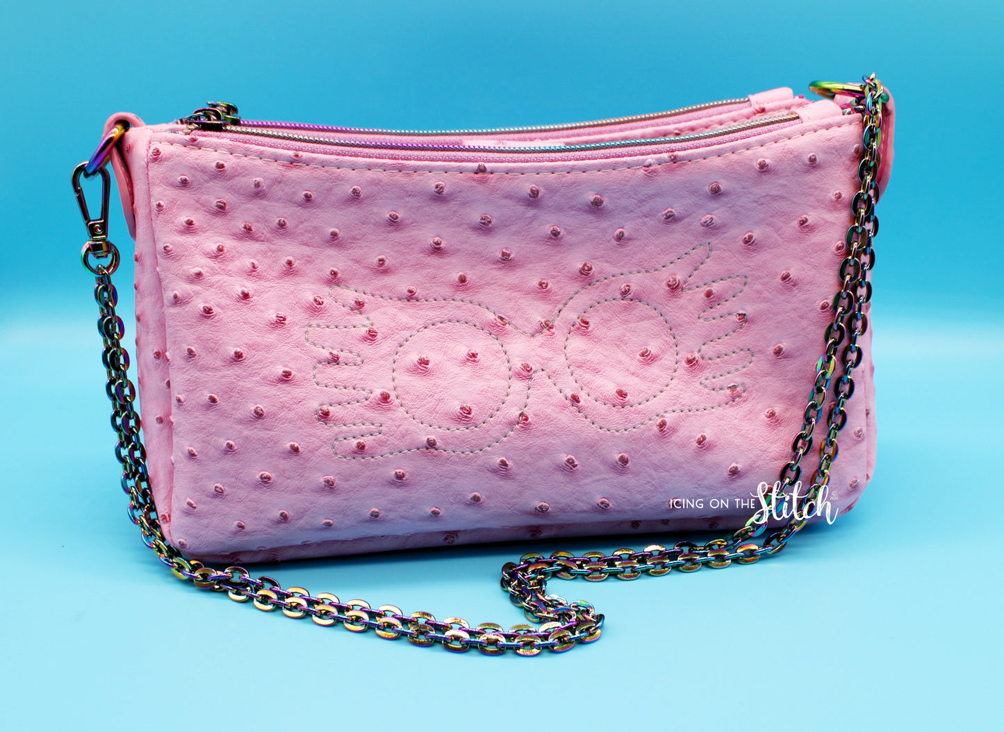 Quibbler-Themed Pink Ostrich Faux Leather Aries Crossbody Bag